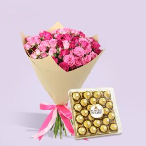 The image shows a bouquet of pink roses wrapped in brown paper with a pink ribbon. Next to it is a box of Ferrero Rocher chocolates.