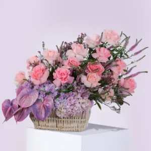 Pink flowers in a woven basket.