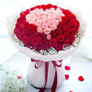 a large and romantic bouquet of roses arranged in the shape of a heart
